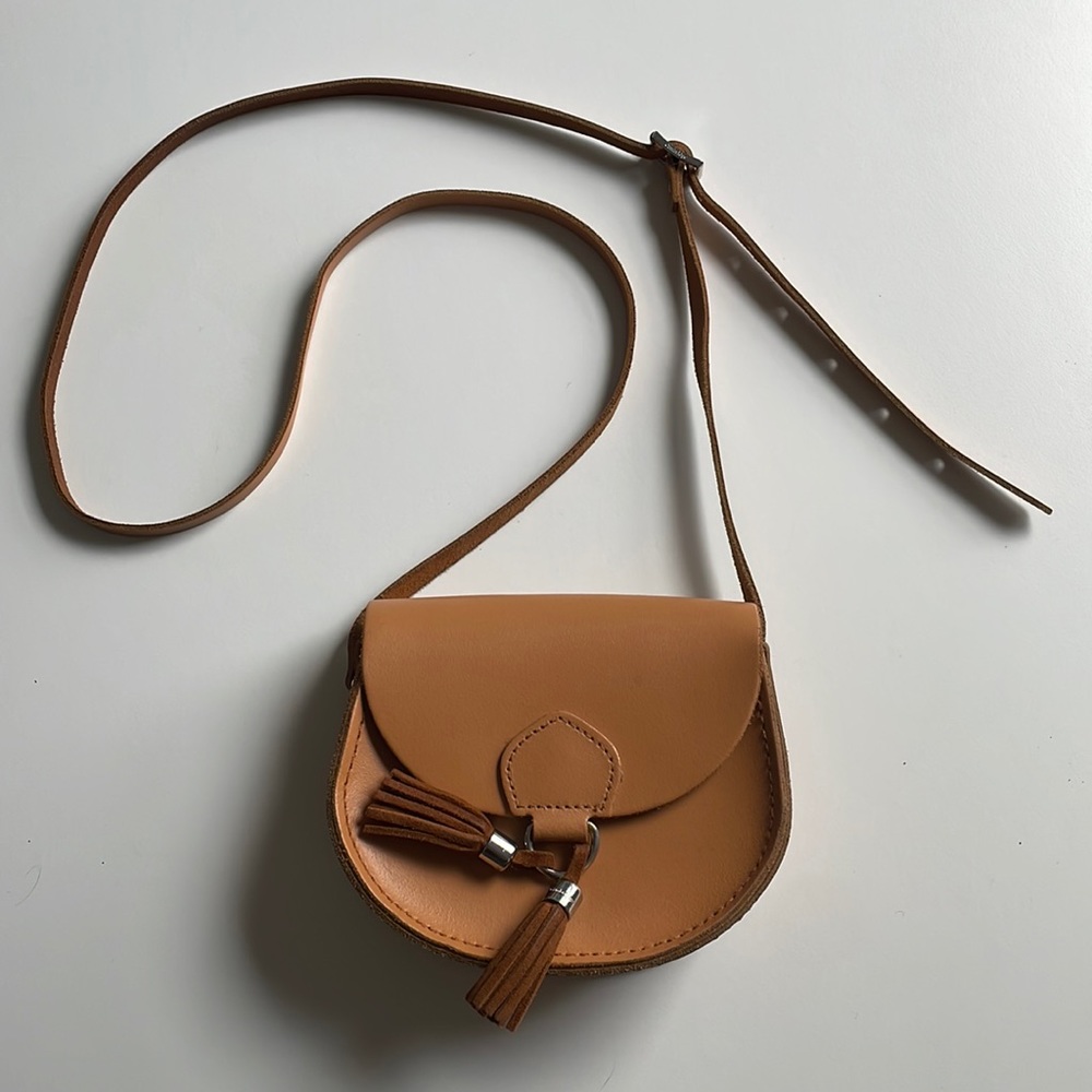 The Cambridge Satchel Co - Mini Tassle saddle bag in color Sand
